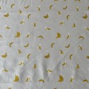 Tissu Coton Orchard Bananes en crème métallisé x10cm