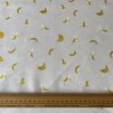 Tissu Coton Orchard Bananes en crème métallisé x10cm